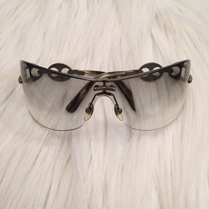 Gucci Rimless Shield Sunglasses with chain detail